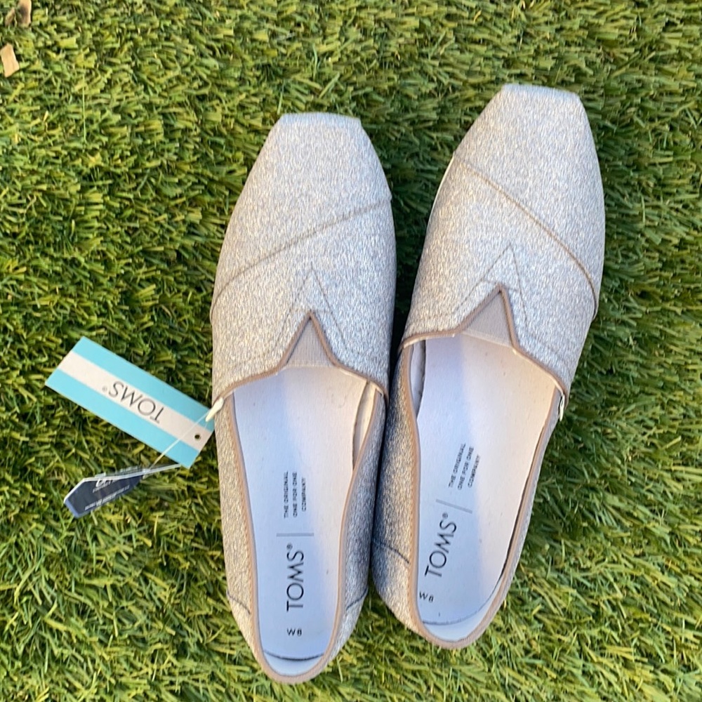 NWT TOMS silver glitter alpargata slip ons